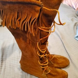 Knee high lace up Minnetonka moccasin boots